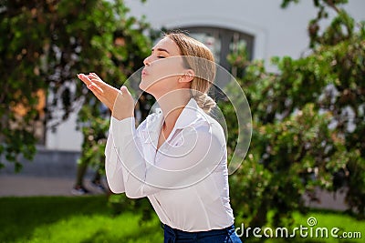 Blow kiss, young caucasian female haired model Stock Photo