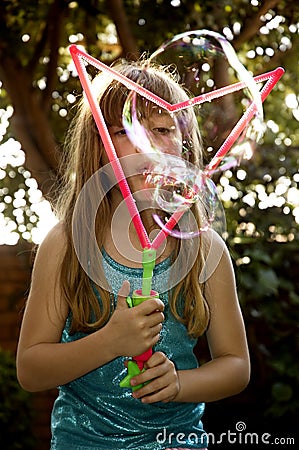 Blowing big bubbles Stock Photo