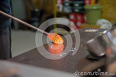 Blowing glass bowl in glasswork in czechia Stock Photo