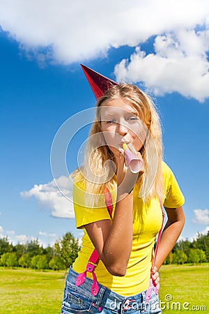 Blowing in party horn Stock Photo