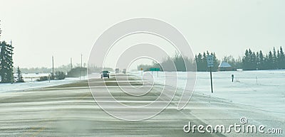 Blowing snow across highway 63 Alberta Stock Photo