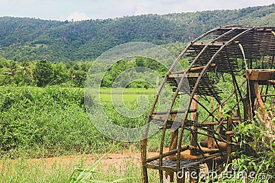 Blows irrigation, wood machinery that can divert water from low to high places without using oil. The wisdom of the local people Stock Photo