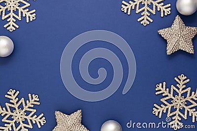 Blue abstract Christmas background frame with silver snowflakes, baubles and confetti winter decoration, blue mock up with space Stock Photo