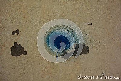 blue aerosol splodge with background peeling white paint Stock Photo