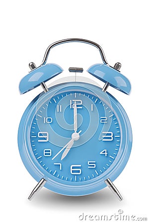 Blue alarm clock with the hands at 7 am or pm isolated on a white background Stock Photo