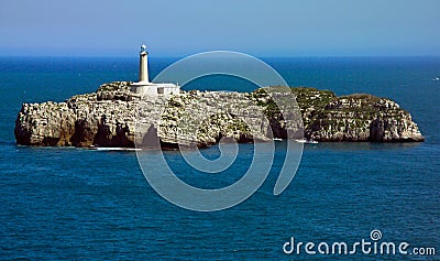 Rocky Island with lighttower near Santander - Spain Stock Photo