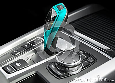 Blue Automatic gear stick of a modern car. Modern car interior details. Close up view. Car detailing. Automatic transmission lever Stock Photo