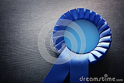 Blue award rosette with ribbons and copy space Stock Photo