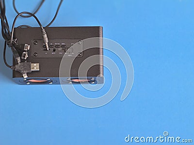 Blue background, channel switch, socket, power cable, USB micro USB cable, audio and radio waves Editorial Stock Photo