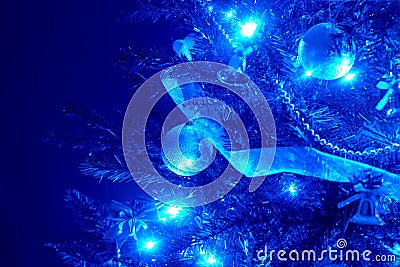 Blue background with christmas tree, ball, light. Stock Photo