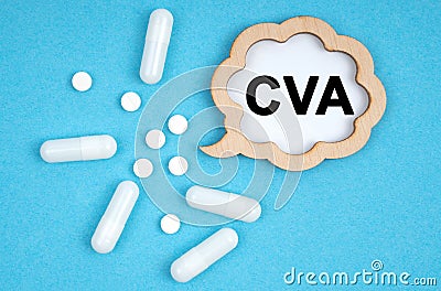 On a blue background, pills and a plate, inside which the inscription - CVA Stock Photo