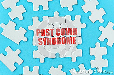 On a blue background are puzzles with the inscription - Post covid syndrome Stock Photo