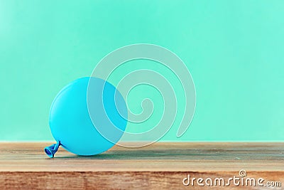 Blue balloon wooden table copy space Party background Stock Photo