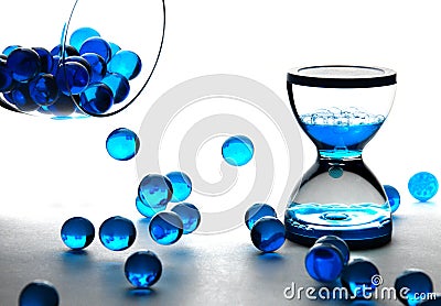 Blue balls and clepsydra Stock Photo