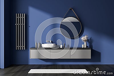 Blue bathroom interior with sink and mirror, accessories on drawer Stock Photo