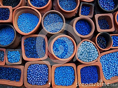 Blue beads in terra cotta pots. Stock Photo