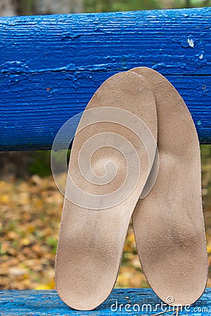 Blue bench with leather orthopedic insoles on it. Healthy relax Stock Photo