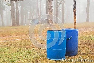 Blue bins in parks Stock Photo