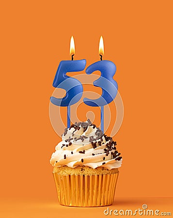 Blue birthday candle and cupcake - Number 53 Stock Photo