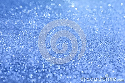 Blue blurred background with highlights and fine texture of shiny crystals Stock Photo