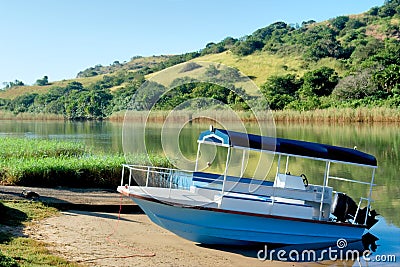 Blue boat on morning river Stock Photo