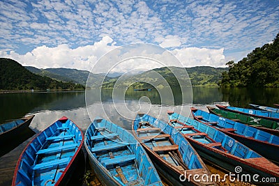 Blue boats in Lake Pokhara nepal Stock Photo
