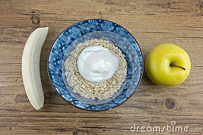 Oatmeal with Greek yogurt banana and apple Stock Photo