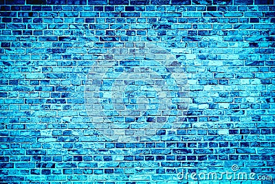 Blue brick wall painted with different tones and hues of blue as seamless pattern texture background Stock Photo