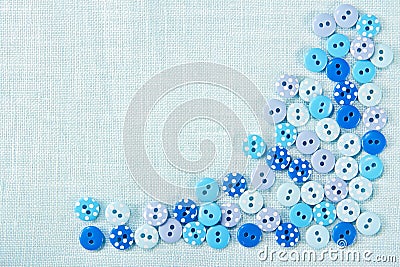 Blue buttons on linen - sewing background Stock Photo