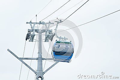 Blue cabin cable car at the tower. Bottom view Editorial Stock Photo