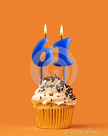Blue birthday candle and cupcake - Number 61 Stock Photo