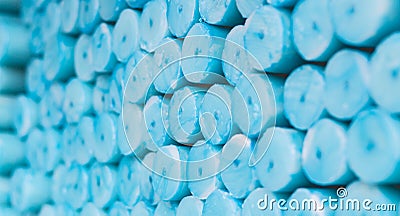 blue candles for pray stacked in Lourdes to sell, religious symbol Stock Photo