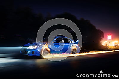 Blue car drive on asphalt countryside road with fire wheels at night Stock Photo