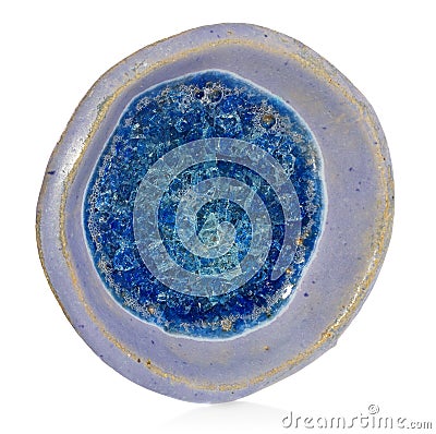 Blue, ceramic, handmade round bowl. At the bottom broken glass w Stock Photo