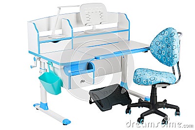 Blue chair, school desk, blue basket, desk lamp and black support under legs Stock Photo