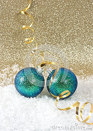 Blue christmas baubles with golden streamer Stock Photo
