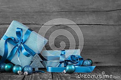 Blue christmas presents on wooden grey shabby background. Stock Photo