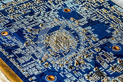 Blue circuit board PCB with many microscopic electronic parts Stock Photo