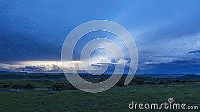 Blue clouds and green grass Stock Photo