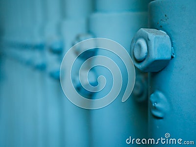 Blue coated nut dirty in a row Stock Photo