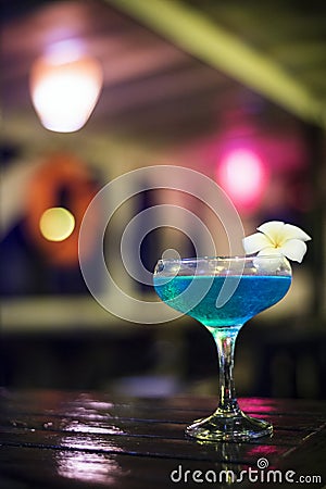 Blue cocktail drink in dark bar interior Stock Photo