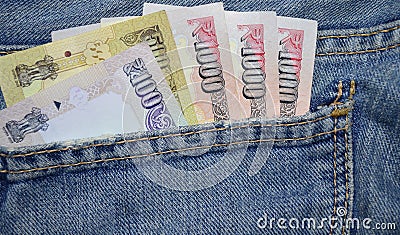 Blue color Denim Pocket with Indian Money Stock Photo