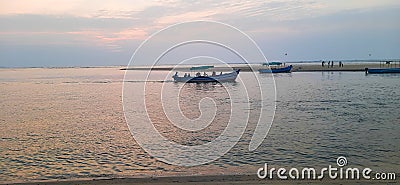 A blue colored boat carrying passengers in the water Editorial Stock Photo