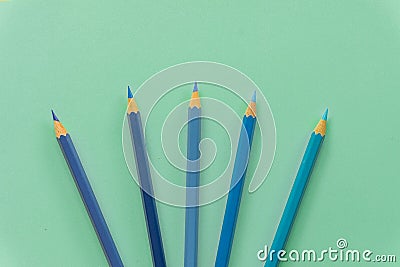 Blue colored pencil One single object, top view, bright tint. Wooden hexagonal barrel, without eraser. H Stock Photo