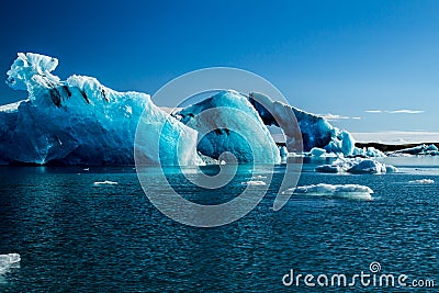 Blue coloured icebergs in glacier lagoon Stock Photo