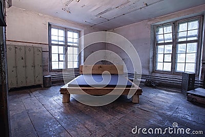 Blue comfortable mattress on a wooden frame. Stock Photo