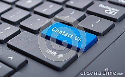 Blue contact us button on black keyboard concept Stock Photo
