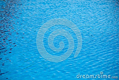 Blue and crystalline water of a swimming pool Stock Photo