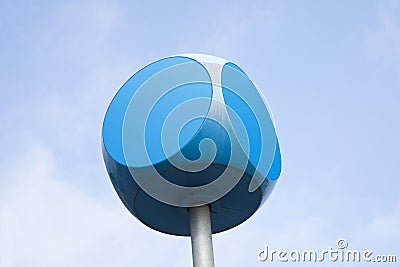 Blue cube with rounded edges against sky background with copy sp Stock Photo