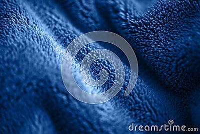 Blue delicate soft background of fur plush smooth fabric. Texture of fleecy blanket textile Stock Photo